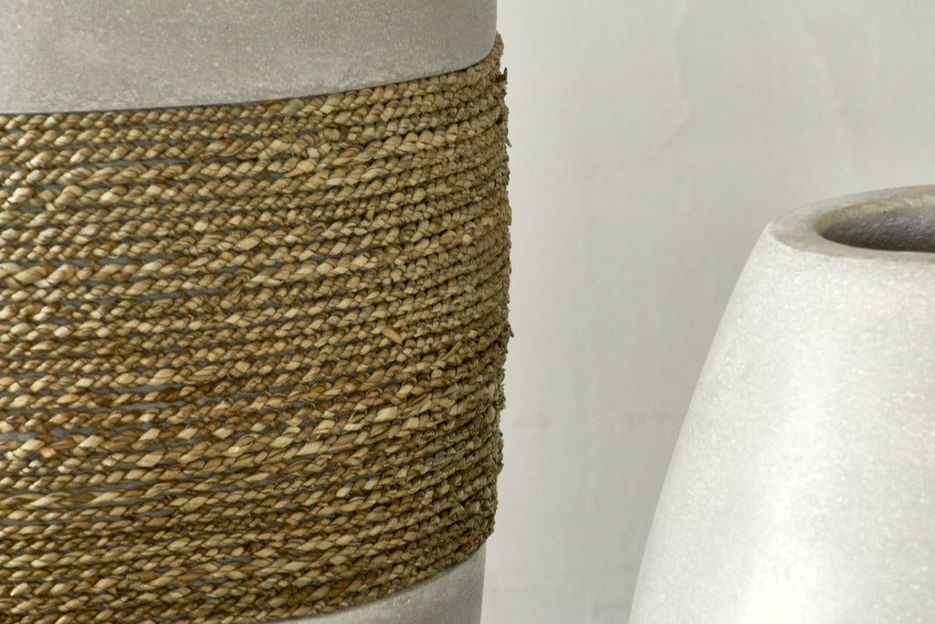 Large decorative vase in cement and seagrass